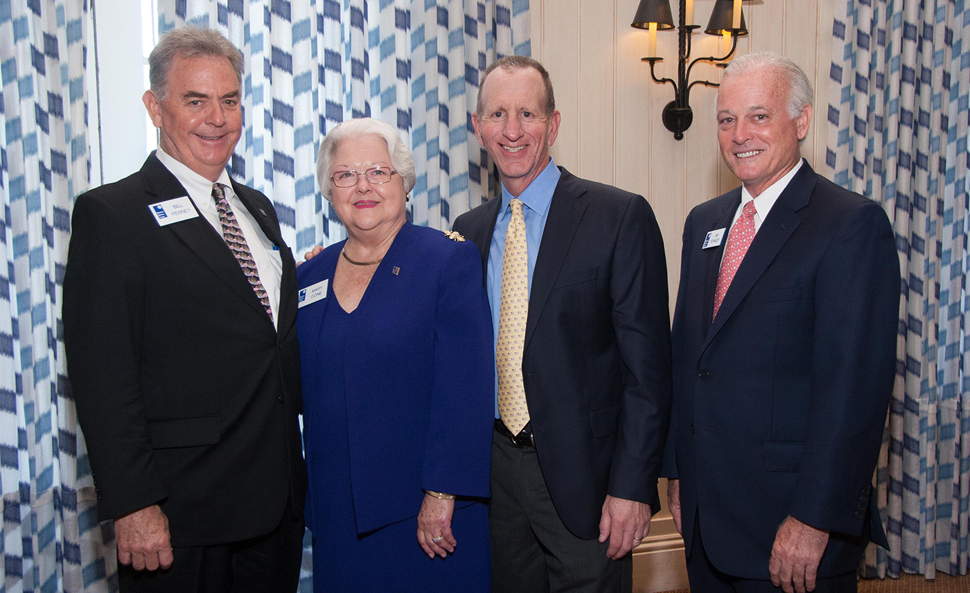 Marine Bank President and CEO Bill Penney, Vice President Mary Cone, Fox Business News Commentator Gary B. Smith, and Residential Loan Officer Jim Stanley.